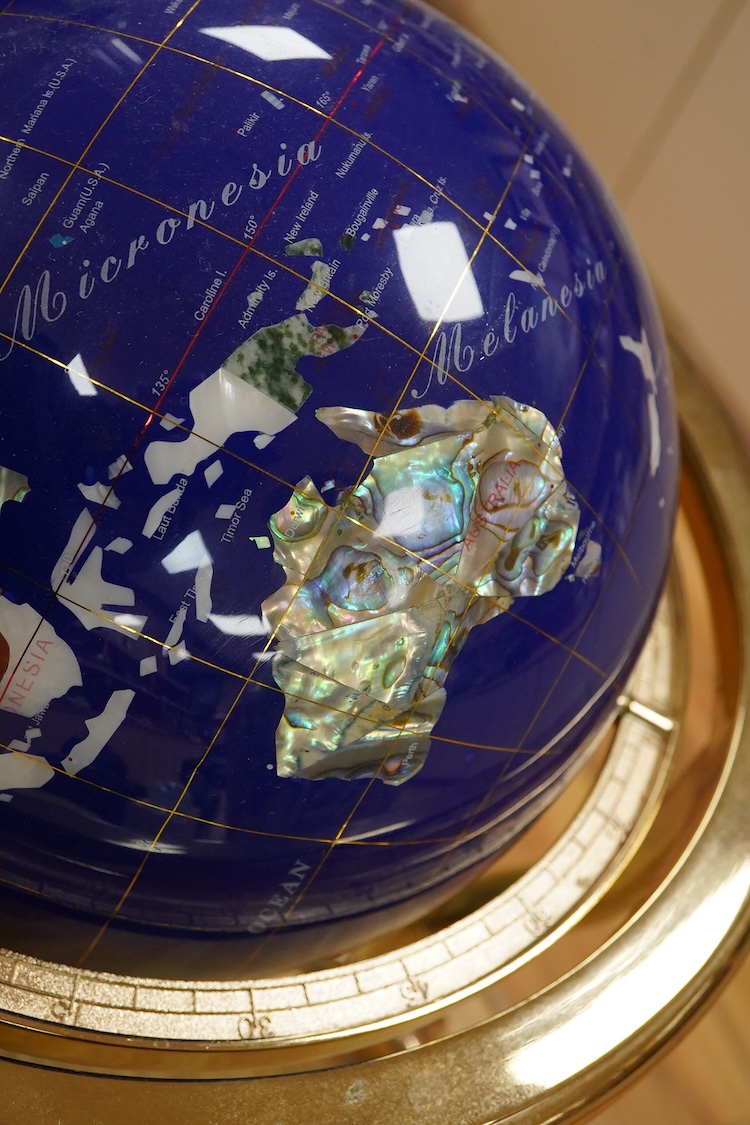 A simulated multi-mineral globe with compass, 30cm in diameter